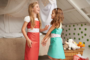 Image showing Fashion, paper and children friends with dress for fun, show or playing together at home. Happy, smile and young girl kids in gift wrap outfit for style with bonding in bedroom at modern house.