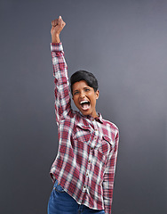 Image showing Happy, portrait and Indian person with excited win with gray background from creative agency promotion. Hipster, confidence and employee smile with wow, yes and winner at job with achievement