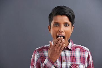 Image showing Yawn, tired and portrait for woman with gesture for sleepy, fatigue and bored on mockup. Indian person with hand on mouth for etiquette, snooze and symbol for lazy, exhausted and relax in studio