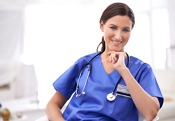 Image showing Nurse, portrait and healthcare worker in scrubs at hospital, medical center or clinic. Happy, lens flare and confident female medicine professional for trust, support and wellness internship