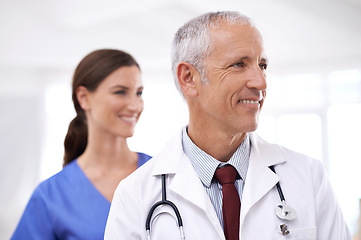 Image showing Doctors, man and woman with smile at clinic for medical support, vision and partnership with ideas. Mature medic, people and nurse in team, happy or health services at hospital for thinking in career