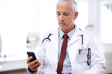 Image showing Healthcare, man and doctor with smartphone in hospital for wellness research, medical app or online consult. Clinic, advice and mature medic by mobile phone for internet, communication or networking