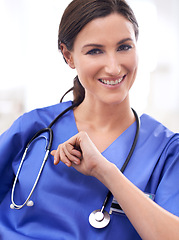 Image showing Portrait, nurse and happy woman in hospital for healthcare, wellness or working on career in Spain. Face, medical professional and smile of surgeon, employee or expert doctor in clinic for service