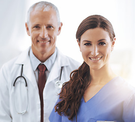 Image showing Doctor, nurse and happy together in portrait with smile, medical support and wellness in hospital. Medic, mature man and woman in team, smile and healthcare services in clinic with pride for career