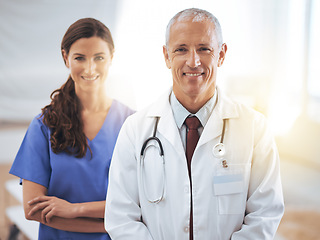 Image showing Doctors, man and woman in portrait at hospital for medical support, wellness and arms crossed with smile. Medic, surgeon and nurse in team, happy and health services in clinic with pride for career