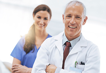 Image showing Doctor, nurse and partner in portrait with arms crossed, medical support and wellness at hospital. Medic, mature man and woman in team, happy and healthcare services at clinic with pride for career