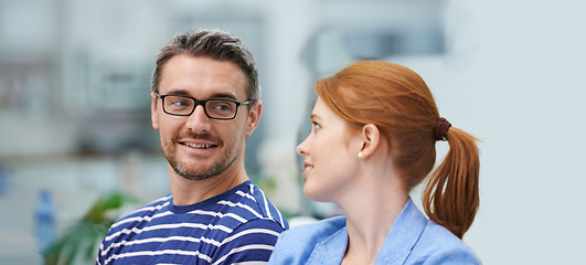 Image showing Man, woman and smile in startup office for conversation, team or advice for decision at company. Business people, happy and talk for negotiation, planning or listen to ideas at creative media agency