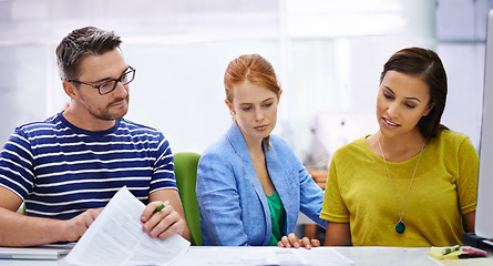 Image showing Business people, research and paperwork for planning in office, reading and discussion for solution. Colleagues, teamwork and documents for problem solving or strategy in creative agency meeting