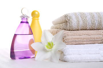 Image showing aromatic oil, shampoo and towel