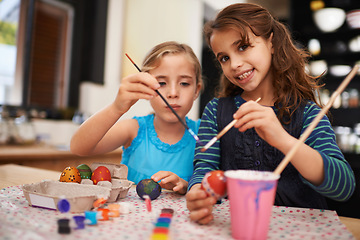 Image showing Girl, sister and portrait for painting easter eggs with bonding, connection and festive decoration in home. Children, paintbrush and creativity with art, love or together for learning in family house