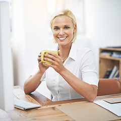 Image showing Business woman, computer and portrait with coffee, smile or pride with confidence in morning at modern office. Person, employee and happy by pc with drink, tea cup and start day at corporate company
