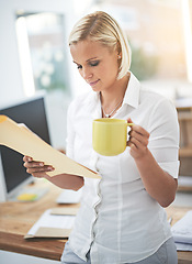 Image showing Woman, reading and document with coffee in office to start morning with thinking, ideas and review at law firm. Attorney, lawyer or advocate with folder, paperwork and legal information with tea cup