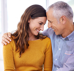 Image showing Couple, laughing and hug in home for love with support, funny joke and comfort in living room of house. Senior man, woman and smile with face for embrace, affection and healthy relationship in lounge