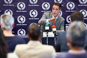 Image showing Politician man, press conference and announcement on news with journalist group in audience for questions. People, interview and story with information for public relations, global seminar and crowd