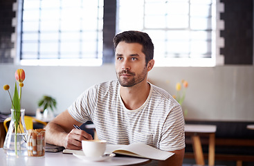 Image showing Coffee, thinking and man with notebook in restaurant, cafeteria and diner for remote work. Freelance, career and person with book for planning, ideas or project with beverage, caffeine and cappuccino