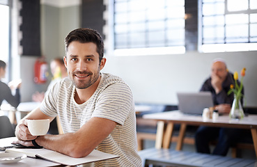 Image showing Man, tea and freelancer portrait in coffee shop, ideas and planning for startup company in cafe. Male person, latte and relax in restaurant for remote work in notebook, contemplating and inspiration