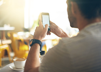 Image showing Man, hands and typing with phone at coffee shop in social media, communication or networking at cafe. Closeup of male person on mobile smartphone for online chatting, texting or message at restaurant