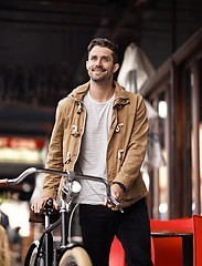 Image showing City, commute and happy man with bicycle walking on sidewalk, smile and eco friendly transport. Carbon neutral, sustainability and tourist on urban journey, morning travel or male with bike on street