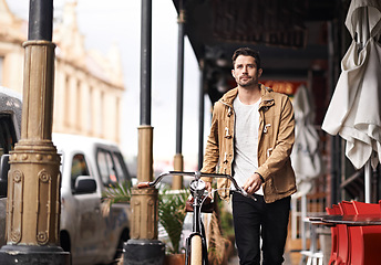 Image showing City, commute and man with bike walking on sidewalk, thinking and eco friendly transport. Carbon neutral, sustainability and tourist on street for urban journey, morning travel and male with bicycle