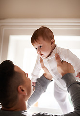 Image showing Love, hug or father lifting baby in a house with care, trust and child development, support or bonding. Family, security and dad with kid at home for learning, safety or morning games with gratitude