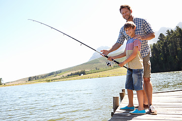 Image showing Father, child and fishing in a nature portrait for learning, teaching and outdoor with holiday, travel or sustainable living. Happy family, dad and boy or kid with rod by water or lake for camping