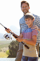 Image showing Fishing, portrait or father and son in nature for travel, bonding and vacation, holiday or trip. Fish, line or kid with dad outdoor with love, learning or sustainable living while camping in a forest
