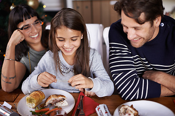 Image showing Christmas, family and parents with child for dinner, lunch and eating together for festival event. Mother, father and girl with food for holiday, vacation and festive celebration at dining table