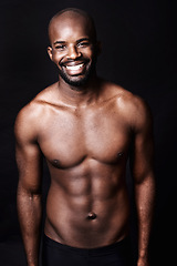 Image showing Black man, shirtless and body with smile in portrait, fitness and health with muscle or abs on dark background. Exercise, sport and athlete with six pack, confident and masculine with testosterone