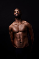 Image showing Black man, model and muscle with fitness, fashion or masculine figure on a dark studio background. Attractive African, male person or bodybuilder with eyes closed for abs or strength on mockup space