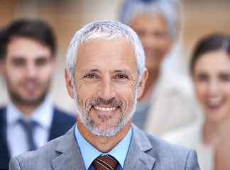 Image showing Business man, portrait and CEO for leadership with team, confidence and about us, management or law firm. Face of senior lawyer, employees and group of people with smile or happy for career values