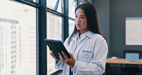 Image showing Healthcare, doctor and tablet in hospital with worry for treatment results, telehealth or medical research. Woman, digital technology and concern for information, bad diagnosis or online consultation