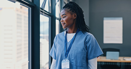 Image showing Nurse, healthcare and thinking at window of hospital with ideas for surgery, medical decision and happy. Medicine, black woman and professional intern thoughtful in the clinic with wonder and smile