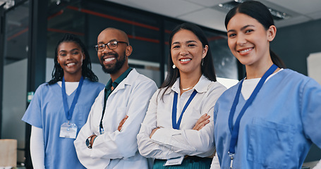 Image showing Doctors, group and happy with arms crossed in hospital with confidence in medical goals or mission. Healthcare, team and portrait of people in clinic working in medicare with pride and diversity