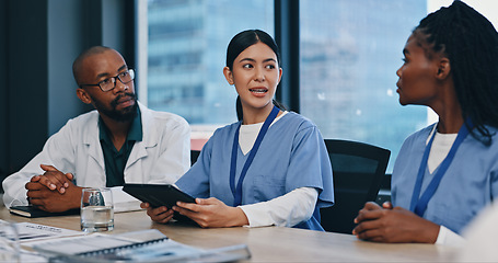 Image showing Healthcare, tablet and teamwork in meeting for research, planning and discussion in hospital for collaboration. Medical, nurses and doctor with people for communication, news report or feedback