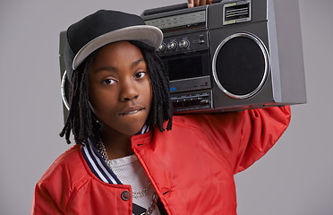 Image showing Black child, confidence and portrait with radio for hip hop, rap and swag dance with cool clothes in studio. Youth, teen clothing and boombox with urban style and fashion and kid with grey background