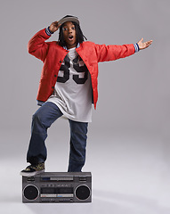 Image showing Black child, wow and portrait with radio for hip hop, rap and swag dance with cool clothes in studio. Smile, teen clothing and boombox with urban style and fashion and kid with grey background