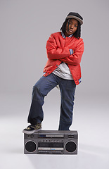 Image showing Child, hip hop and cool portrait with radio for music and rap in a studio with urban clothing. Fashion, African kid and boombox with trendy clothes and youth swag with confidence and grey background