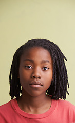 Image showing African boy, portrait and fashion in studio with creative, style and confidence on a yellow background. Face of young and cool model, student or teenager in natural hair and casual or trendy t shirt