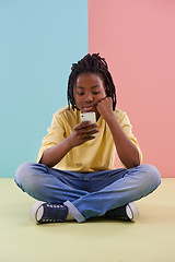 Image showing Search, phone and bored boy child on a floor with social media, reading or ebook in his home. Smartphone, lazy or African teen with app for Netflix and chill sign up, google or or watching video