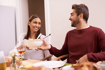 Image showing Smile, dinner and couple at table with salad, food, and drinks for celebration in home. Social event, man and woman at thanksgiving lunch together with wine, relax and romantic holiday date in house