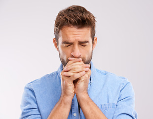 Image showing Man, praying and worship with anxiety and faith in God, seek help and advice for guidance on white background. Spiritual, religion and gratitude with thanks, stress and forgiveness with hope