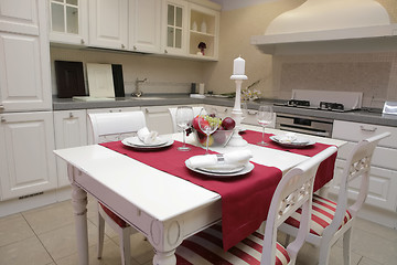 Image showing served table in interior of the modern kitchen