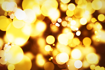 Image showing Abstract, design and gold bokeh with circle, Christmas theme, decor and creativity with color. Wallpaper, effects and sparkle or shine with pattern, shape and creative graphic for screensaver