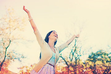 Image showing Hands in the air, park and woman with celebration, smile and excited with achievement and success. Outdoor, person and girl with happiness and cheerful with joy and summer with sunshine and fresh air