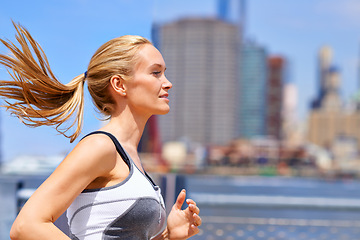 Image showing Woman, wellness and running for fitness in city, jogging active and fit female person exercising in New York. Energy, marathon for sports training and workout for athlete, cardio for endurance