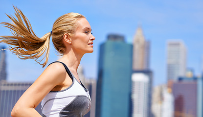 Image showing Woman, outside and running for fitness in city, jogging active and fit female person exercise in New York. Energy, wellness marathon for sports training and workout for athlete, cardio for endurance