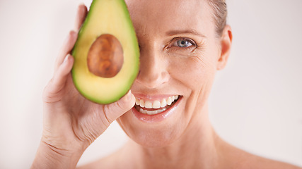 Image showing Skincare, smile and portrait of woman with avocado in studio for health, wellness or natural routine. Glow, beauty and mature person with organic fruit for dermatology treatment by white background.