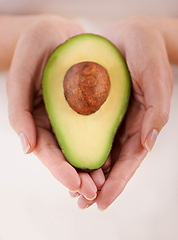 Image showing Hands, avocado and vegetable diet for health, antioxidants and minerals or vitamins for wellness. Closeup, person and holding vegan food for green detox, superfoods and omega 3 for organic skincare