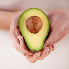 Image showing Hands, avocado and vegetable diet for nutrition, health and minerals or vitamins for wellness. Closeup, person and holding vegan food for green detox, superfoods and omega 3 for organic skincare