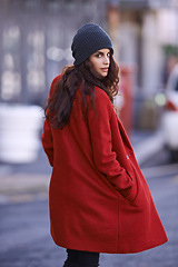Image showing Winter, fashion and portrait of woman in city with jacket for travel in cool style or red coat. Streetwear, clothes and girl walking with confidence and pride outdoor in New York morning commute